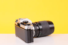 Load image into Gallery viewer, Olympus OM10 35mm Film SLR Camera with Sigma 70–210mm f/4–5.6 Telephoto Zoom Lens