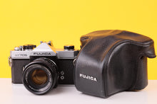 Load image into Gallery viewer, Fujica ST705 35mm Film SLR Camera with Fujinon 50mm Lens