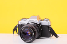 Load image into Gallery viewer, Minolta X-300 35mm Film SLR Camera with Tokina SD 28–70mm f/3.5–4.5 Zoom Lens