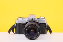 Load image into Gallery viewer, Minolta X-300 35mm Film SLR Camera with Tokina SD 28–70mm f/3.5–4.5 Zoom Lens