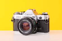 Load image into Gallery viewer, Canon AE-1 35mm SLR Film Camera with 50mm f1.8 lens