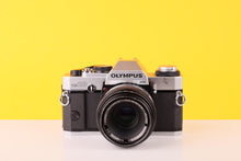 Load image into Gallery viewer, Olympus OM20 35mm SLR Film Camera with Zuiko 50mm f3.5 Lens