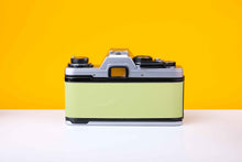 Load image into Gallery viewer, Olympus OM10 Slr Vintage 35mm Film Camera with Zuiko 50mm f1.8 Prime Lens Reconditioned With New Lime Leather Skin