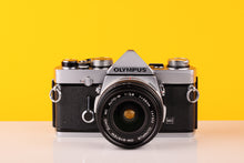 Load image into Gallery viewer, Olympus OM-1n 35mm Film Camera with Olympus Zuiko OM-System MC Auto-W 28mm Lens