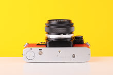 Load image into Gallery viewer, Olympus OM10 35mm Film Camera with Zuiko 50mm f1.8 Prime Lens Red Leather Skin