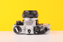 Load image into Gallery viewer, Olympus OM10 35mm SLR Film Camera with Manual Adapter and Olympus Zuiko MC Auto-S 50mm f1.8