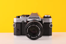 Load image into Gallery viewer, Olympus OM20 35mm SLR Film Camera with Zuiko 50mm Lens