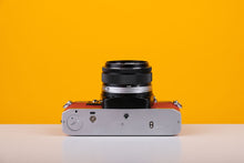 Load image into Gallery viewer, Olympus OM10 35mm Film Camera with Zuiko 50mm f1.8 Prime Lens Red Leather Skin