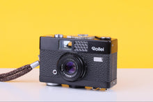 Load image into Gallery viewer, Vintage Rollei camera on a yellow background