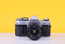 Load image into Gallery viewer, Canon AE-1 35mm SLR Film Camera with Canon 28mm f/2.8 Lens
