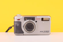 Load image into Gallery viewer, Vintage digital camera on a yellow background