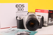 Load image into Gallery viewer, Canon EOS 300/ Kiss III 35mm SLR Film Camera with Canon 50mm f/1.8 Lens