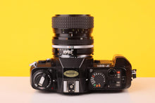 Load image into Gallery viewer, Nikon F-301 35mm SLR Film Camera with Nikkor 35-70mm f3.3-4.5 Lens