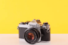 Load image into Gallery viewer, Nikon FE Silver 35mm Film Camera with Nikon 50mm f/1.8 Lens