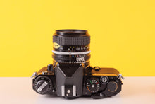 Load image into Gallery viewer, Nikon FE Black 35mm Film Camera with Nikon 35mm f/2.8 Lens