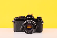 Load image into Gallery viewer, Nikon FM Black 35mm Film Camera with Nikon Series E 50mm f/1.8 Lens
