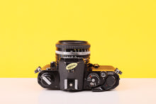 Load image into Gallery viewer, Nikon FM Black 35mm Film Camera with Nikon Series E 50mm f/1.8 Lens