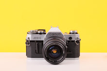 Load image into Gallery viewer, Canon AE-1 35mm Film Camera with Tokina 28mm f2.8 Zoom Lens