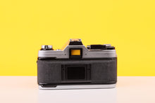 Load image into Gallery viewer, Canon AE-1 35mm Film Camera with Tokina 28mm f2.8 Zoom Lens