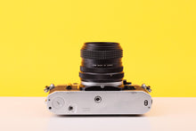 Load image into Gallery viewer, Canon AE-1 35mm Film Camera with Tokina 28mm f2.8 Zoom Lens