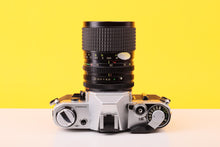 Load image into Gallery viewer, Canon AE-1 35mm Film Camera with Tokina 28-85mm f3.5 Zoom Lens