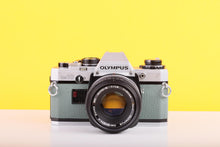Load image into Gallery viewer, Olympus OM10 35mm Film Camera with Zuiko 50mm f1.8 Prime Lens Safari Green