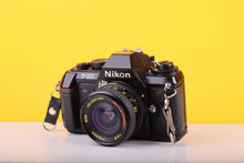 Load image into Gallery viewer, Nikon F-301 35mm SLR Film Camera with Bell & Howell 24mm f/2.8 Lens