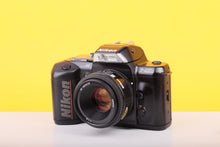 Load image into Gallery viewer, Nikon F-401s 35mm SLR Film Camera with AF Nikkor 50mm f/1.8 Lens