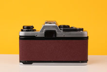 Load image into Gallery viewer, Olympus OM10 35mm Film Camera with Zuiko 50mm f1.8 Prime Lens Burgundi
