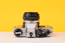 Load image into Gallery viewer, Olympus OM10 35mm SLR Film Camera with Olympus Zuiko 28mm f/2.8 Lens