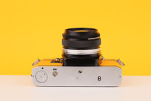 Load image into Gallery viewer, Olympus OM10 35mm SLR Film Camera with Olympus Zuiko 28mm f/2.8 Lens