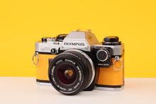 Load image into Gallery viewer, Olympus OM10 35mm SLR Film Camera with Olympus Zuiko 28mm f/2.8 Lens and Manual Adapter