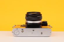 Load image into Gallery viewer, Olympus OM10 35mm SLR Film Camera with Olympus Zuiko 28mm f/2.8 Lens and Manual Adapter