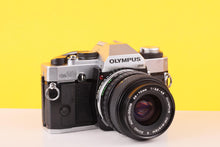 Load image into Gallery viewer, Olympus OM20 35mm SLR Film Camera with Zuiko 35-70mm f/3.5 Lens