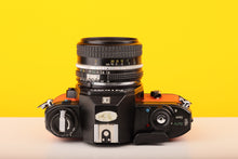 Load image into Gallery viewer, Nikon EM 35mm Film Camera with Nikon 50mm f/1.8 Lens