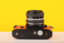 Load image into Gallery viewer, Nikon EM 35mm Film Camera with Nikon 50mm f/1.8 Lens