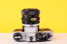 Load image into Gallery viewer, Olympus OM10 35mm SLR Film Camera with Olympus OM-System S Zuiko Auto-Zoom 28-48mm f4 Lens