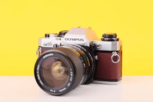Load image into Gallery viewer, Olympus OM10 35mm SLR Film Camera with Miranda 28-70mm f3.5-4.5 MC Macro Lens Burgundy