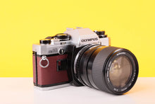 Load image into Gallery viewer, Olympus OM10 35mm SLR Film Camera with Miranda 28-70mm f3.5-4.5 MC Macro Lens Burgundy