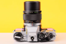 Load image into Gallery viewer, Olympus OM10 35mm SLR Film Camera and Olympus Zuiko Auto-T 135mm f3.5 Lens
