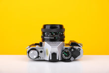 Load image into Gallery viewer, Canon AE-1 Program 35mm Film Camera with Canon FD 50mm f/1.8 Lens