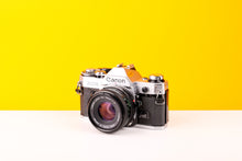 Load image into Gallery viewer, Canon AE-1 35mm SLR Film Camera with Canon FD 50mm f/2 Lens