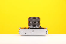 Load image into Gallery viewer, Canon AE-1 Program 35mm SLR Film Camera with Canon 50mm f1.4 FD Lens