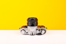 Load image into Gallery viewer, Canon AE-1 35mm SLR Film Camera with Canon FD 50mm f/2 Lens
