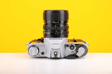 Load image into Gallery viewer, Canon AE-1 35mm SLR Film Camera with Canon Zoom FD 35-70mm f3.5-4.5 Lens