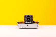 Load image into Gallery viewer, Canon AE-1 35mm SLR Film Camera with Canon FD 50mm f/2 Lens