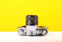 Load image into Gallery viewer, Canon AE-1 35mm SLR Film Camera with Canon FD 50mm f1.4 Lens