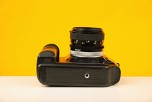Load image into Gallery viewer, Canon T90 35mm Film Camera with Canon 50mm f/1.4 Lens