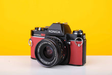 Load image into Gallery viewer, Konica Autoreflex TC 35mm SLR Film Camera with Konica Hexanon AR 28mm f3.5 Prime Lens in Red