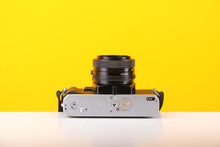 Load image into Gallery viewer, Minolta X-300 35mm Film Camera with Minolta MD 50mm f1.7 Lens